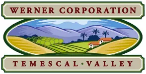 Logo for Werner Corporation, featuring an illustration of rolling green fields, two small houses with red roofs, palm trees, and purple mountains in the background. The words "WERNER CORPORATION" are displayed at the top and "TEMESCAL VALLEY" at the bottom in bold, uppercase letters.